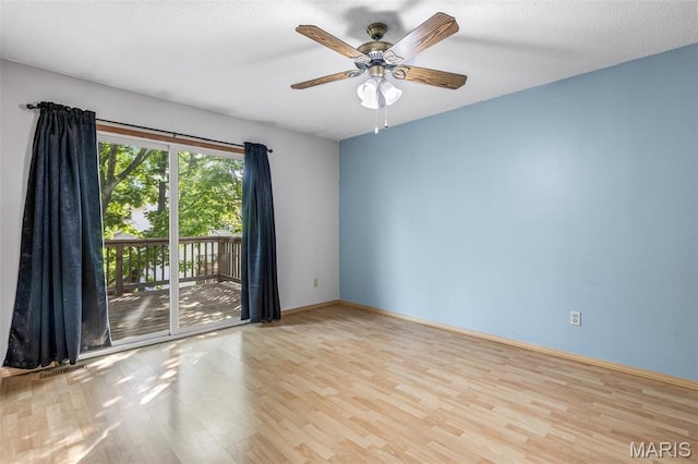 101 Carnegie Ct, Valley Park, MO 63088 - spare room featuring wood finished floors, a ceiling fan, and baseboards