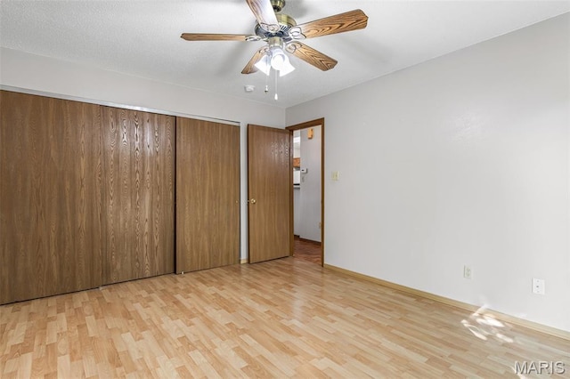 101 Carnegie Ct, Valley Park, MO 63088 - unfurnished bedroom with wood finished floors, a closet, baseboards, and a ceiling fan