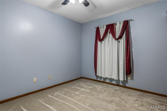 101 Carnegie Ct, Valley Park, MO 63088 - carpeted spare room featuring a ceiling fan, baseboards, and a textured ceiling
