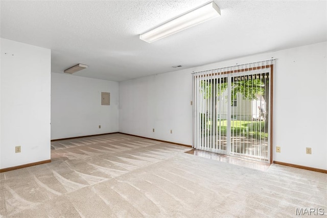 101 Carnegie Ct, Valley Park, MO 63088 - spare room featuring carpet flooring, baseboards, a textured ceiling, and electric panel