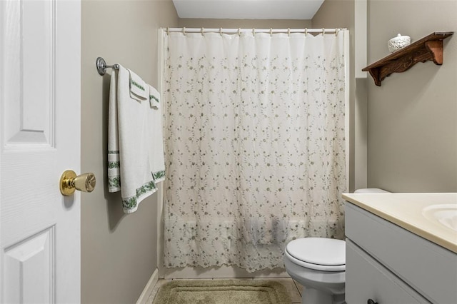 303 Holly Tree Ln, Farmington, MO 63640 - bathroom with vanity, toilet, tile patterned floors, and baseboards