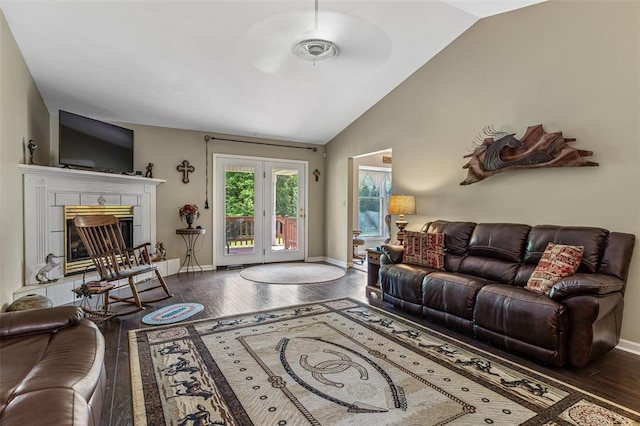 303 Holly Tree Ln, Farmington, MO 63640 - living room featuring vaulted ceiling, hardwood / wood-style floors, baseboards, and a glass covered fireplace