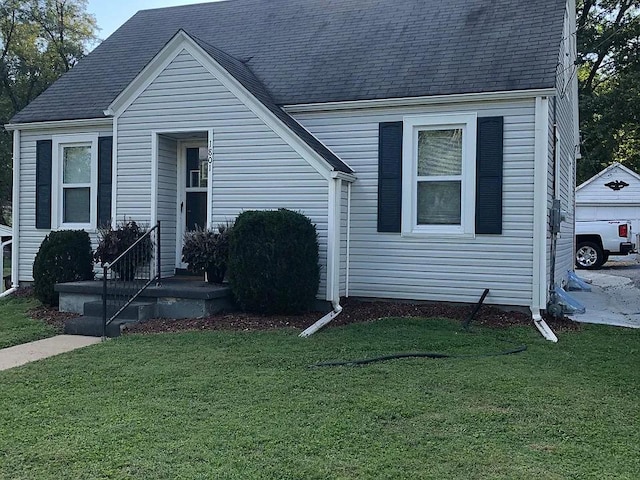 1801 N W End Blvd, Cape Girardeau, MO 63701 - view of front of home featuring a front yard and a shingled roof