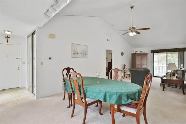 1306 Glendale Gardens Dr Unit C, Glendale, MO 63122 - dining area featuring light carpet, ceiling fan, and high vaulted ceiling