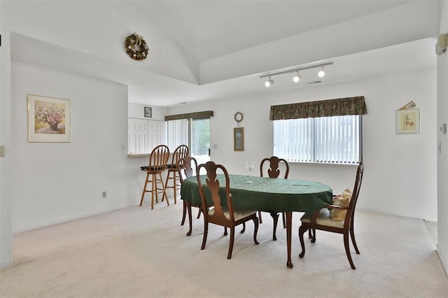 1306 Glendale Gardens Dr Unit C, Glendale, MO 63122 - dining space with light colored carpet, track lighting, baseboards, and vaulted ceiling