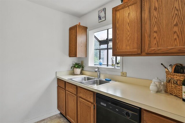 1306 Glendale Gardens Dr Unit C, Glendale, MO 63122 - kitchen with dishwasher, a sink, brown cabinetry, and light countertops