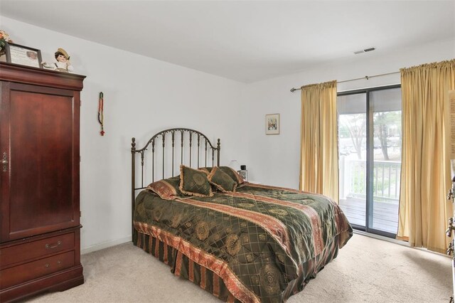 1306 Glendale Gardens Dr Unit C, Glendale, MO 63122 - bedroom with light colored carpet and access to exterior