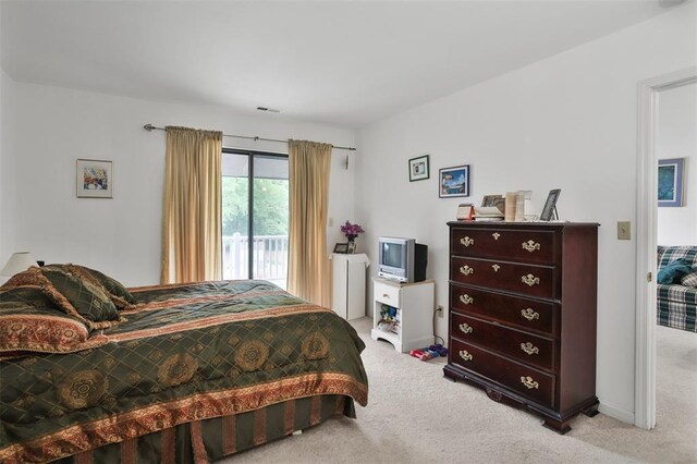 1306 Glendale Gardens Dr Unit C, Glendale, MO 63122 - bedroom featuring carpet and access to exterior