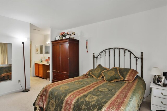 1306 Glendale Gardens Dr Unit C, Glendale, MO 63122 - bedroom featuring light carpet, baseboards, and ensuite bathroom