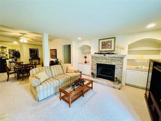 2087 Hawks Landing Dr Unit S, Lake St Louis, MO 63367 - living area featuring a brick fireplace, light carpet, a ceiling fan, a textured ceiling, and recessed lighting