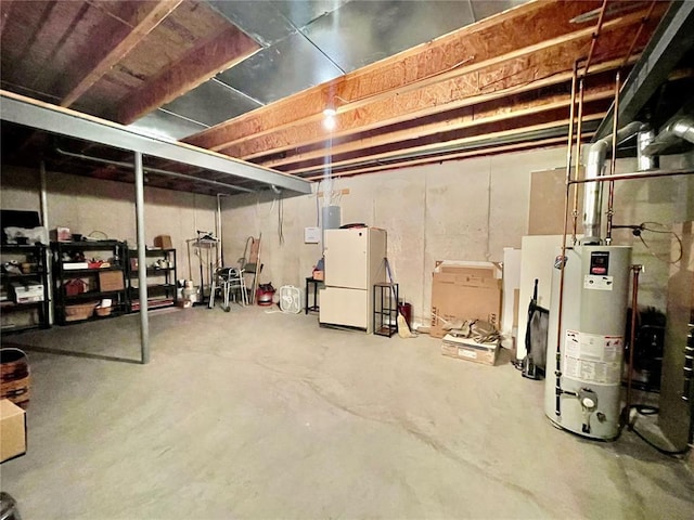 2087 Hawks Landing Dr Unit S, Lake St Louis, MO 63367 - unfinished basement featuring gas water heater and freestanding refrigerator