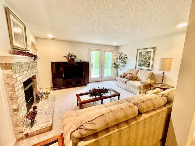 2087 Hawks Landing Dr Unit S, Lake St Louis, MO 63367 - living room with a textured ceiling, carpet, recessed lighting, and a fireplace