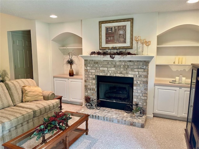 2087 Hawks Landing Dr Unit S, Lake St Louis, MO 63367 - living area featuring a brick fireplace, light carpet, recessed lighting, and a textured ceiling