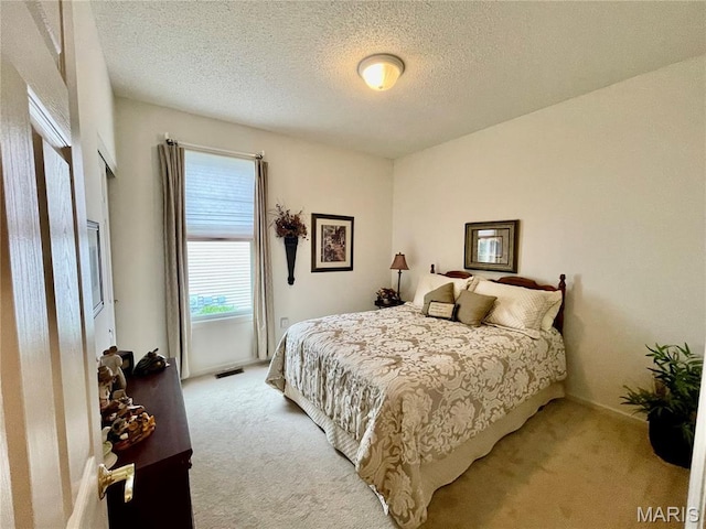 2087 Hawks Landing Dr, Lake St Louis, MO 63367 - bedroom featuring carpet floors and a textured ceiling