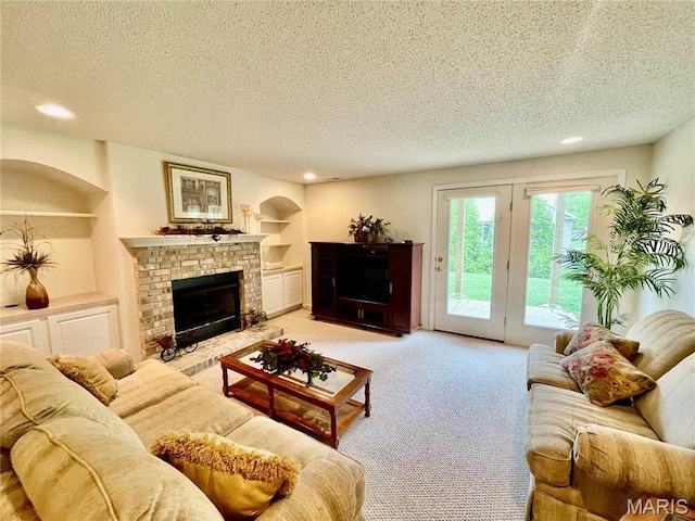 2087 Hawks Landing Dr, Lake St Louis, MO 63367 - living room with a fireplace, a textured ceiling, light colored carpet, recessed lighting, and built in shelves