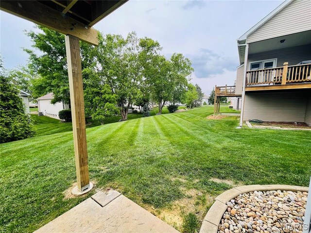 2087 Hawks Landing Dr, Lake St Louis, MO 63367 - view of green lawn featuring a wooden deck