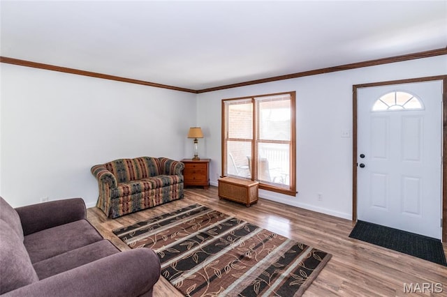 2915 Ozark Dr, Queeny Township, MO 63122 - living area featuring wood finished floors, baseboards, and crown molding