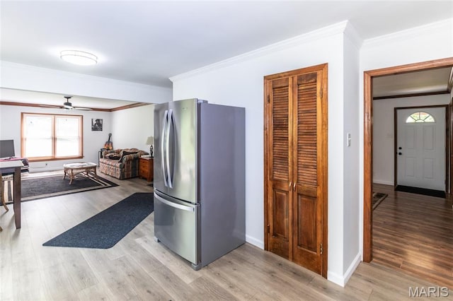 2915 Ozark Dr, Queeny Township, MO 63122 - kitchen featuring freestanding refrigerator, ceiling fan, ornamental molding, light wood-style flooring, and baseboards
