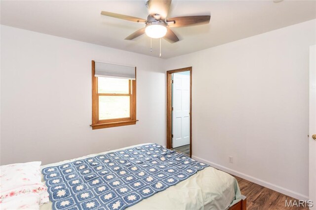 2915 Ozark Dr, Queeny Township, MO 63122 - bedroom with baseboards, wood finished floors, and ceiling fan