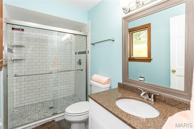 2915 Ozark Dr, Queeny Township, MO 63122 - bathroom featuring toilet, vanity, and a shower stall