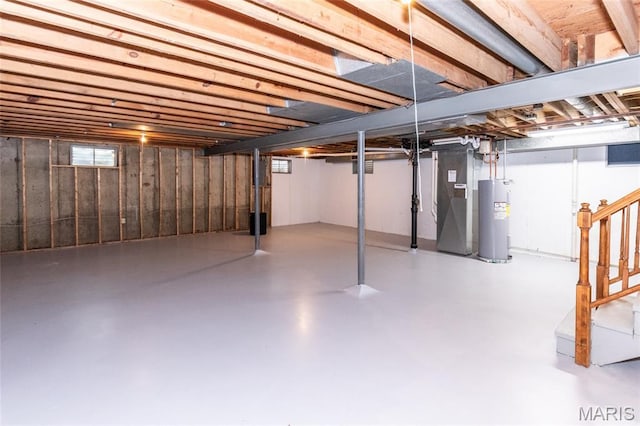 2915 Ozark Dr, Queeny Township, MO 63122 - below grade area featuring water heater, stairs, and heating unit