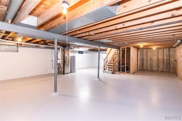 2915 Ozark Dr, Queeny Township, MO 63122 - basement with stairs, water heater, and heating unit