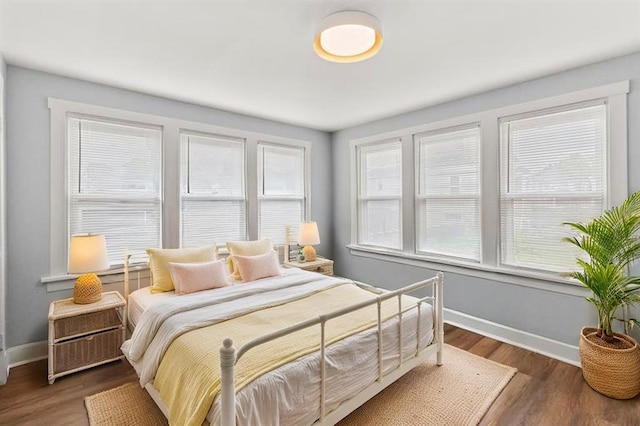 6927 Lansdowne Ave, Saint Louis, MO 63109 - bedroom featuring baseboards and wood finished floors