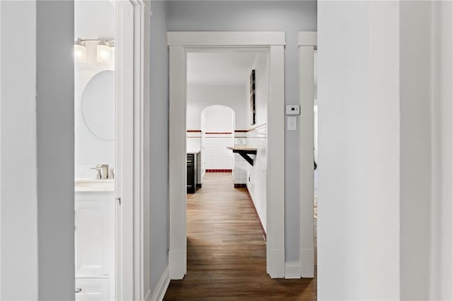 6927 Lansdowne Ave, Saint Louis, MO 63109 - hallway with dark wood finished floors and a sink