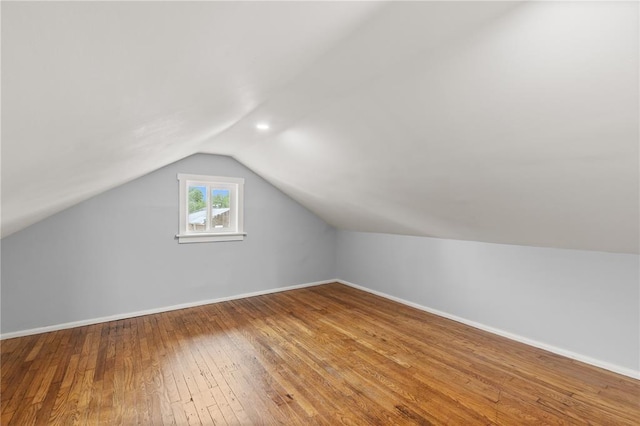 6927 Lansdowne Ave, Saint Louis, MO 63109 - additional living space featuring lofted ceiling, hardwood / wood-style floors, and baseboards