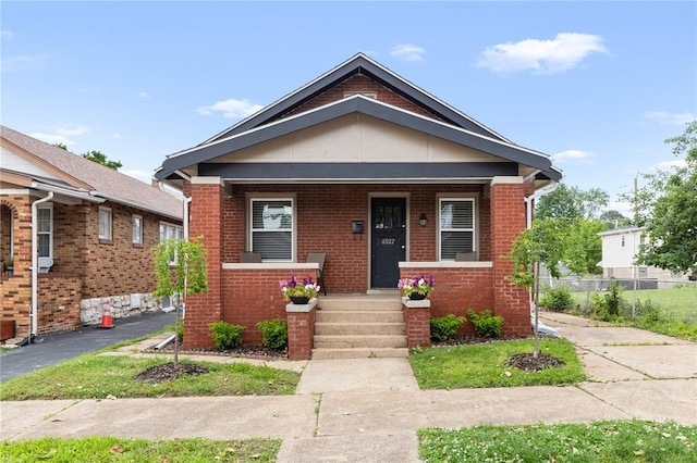 6927 Lansdowne Ave, Saint Louis, MO 63109 - view of front facade featuring brick siding and covered porch