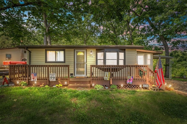 14135 Oak Dr, De Soto, MO 63020 - view of front of home featuring a front yard and a deck