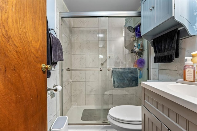 14135 Oak Dr, De Soto, MO 63020 - full bath featuring toilet, tile walls, a stall shower, and vanity