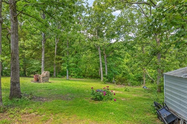 14135 Oak Dr, De Soto, MO 63020 - view of grassy yard with a wooded view