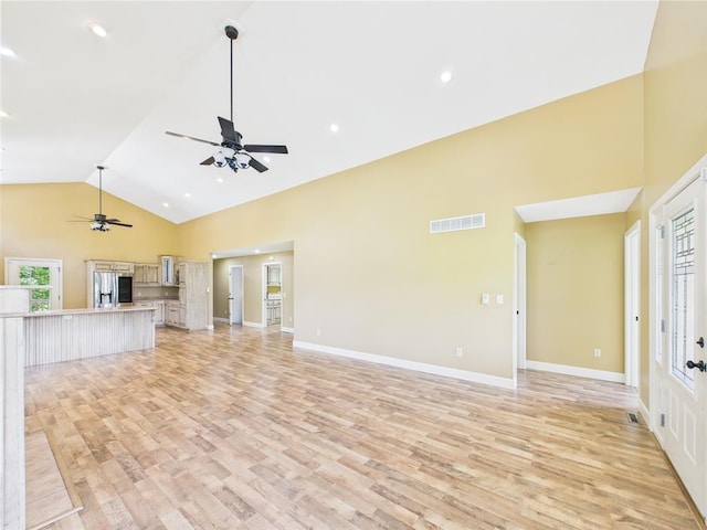 14800 County Road 448, St James, MO 65559 - unfurnished living room with ceiling fan, light wood-style floors, high vaulted ceiling, baseboards, and recessed lighting