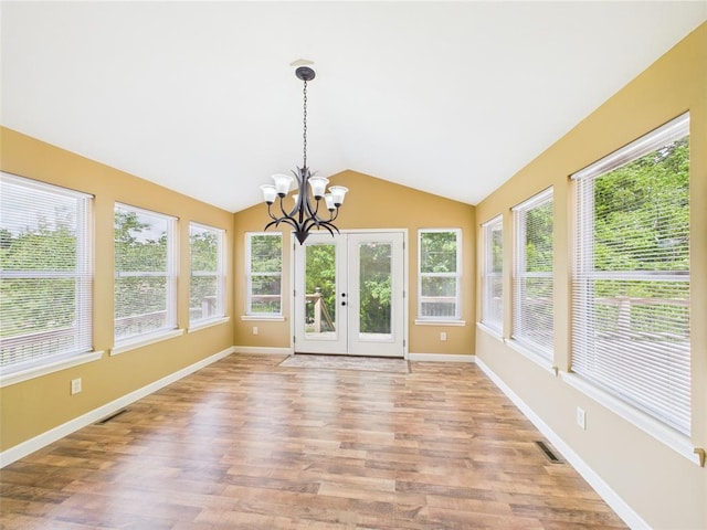 14800 County Road 448, St James, MO 65559 - unfurnished sunroom featuring french doors, lofted ceiling, wood finished floors, baseboards, and a chandelier