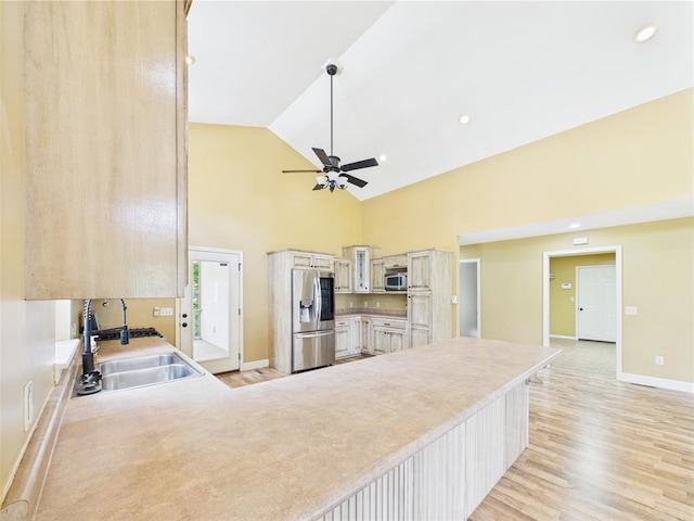 14800 County Road 448, St James, MO 65559 - kitchen featuring stainless steel appliances, a sink, light wood-type flooring, high vaulted ceiling, and ceiling fan