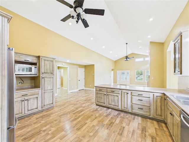 14800 County Road 448, St James, MO 65559 - kitchen with ceiling fan, appliances with stainless steel finishes, light wood finished floors, a peninsula, and light countertops
