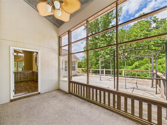 14800 County Road 448, St James, MO 65559 - unfurnished sunroom with a ceiling fan and view of scattered trees