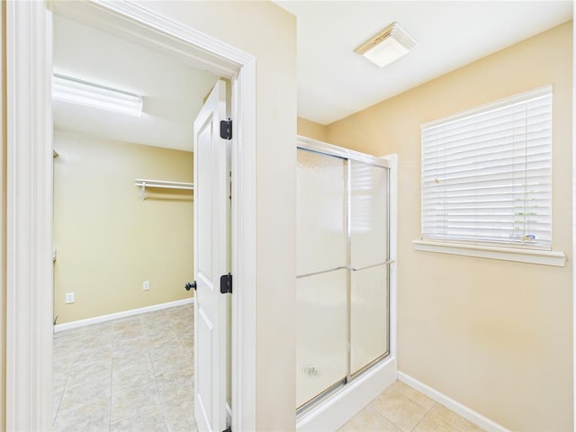 14800 County Road 448, St James, MO 65559 - bathroom with a shower stall, baseboards, and tile patterned flooring