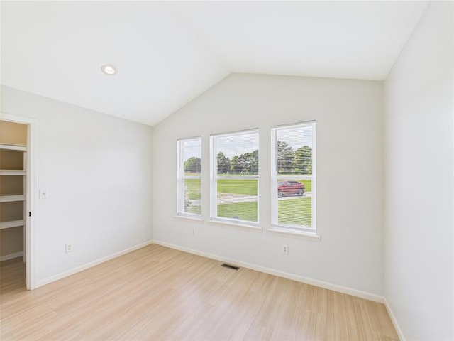 14800 County Road 448, St James, MO 65559 - empty room with light wood-type flooring, baseboards, and vaulted ceiling