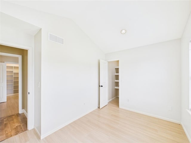 14800 County Road 448, St James, MO 65559 - unfurnished room with vaulted ceiling, light wood-type flooring, and baseboards