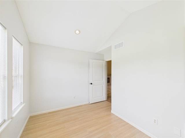 14800 County Road 448, St James, MO 65559 - unfurnished room featuring lofted ceiling, baseboards, and light wood-type flooring