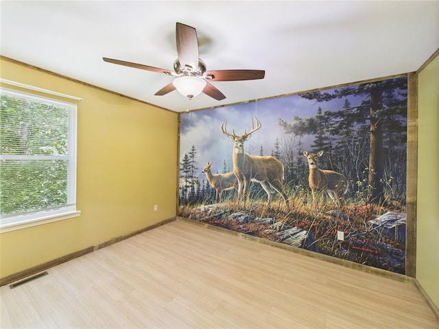 14800 County Road 448, St James, MO 65559 - spare room with a ceiling fan, wood finished floors, healthy amount of natural light, and baseboards