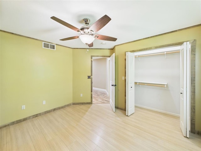 14800 County Road 448, St James, MO 65559 - unfurnished bedroom featuring light wood-style flooring, baseboards, a ceiling fan, and a closet