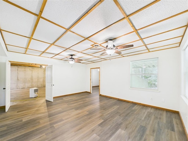 14800 County Road 448, St James, MO 65559 - spare room featuring a ceiling fan, wood finished floors, and baseboards