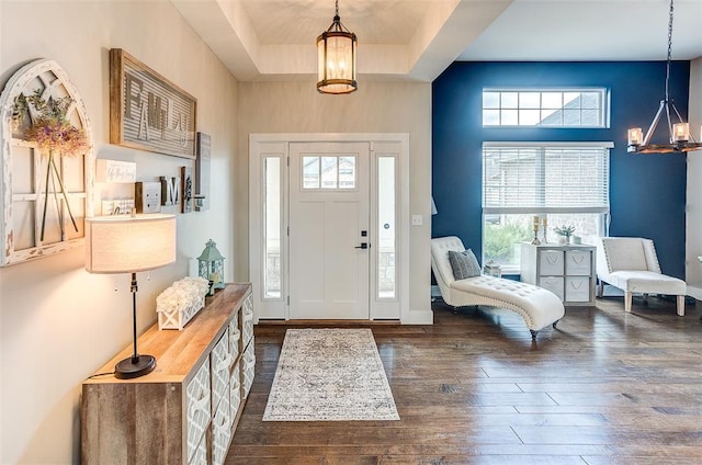 223 Ellington Ct, Glen Carbon, IL 62034 - foyer with a chandelier, dark wood-style floors, and baseboards