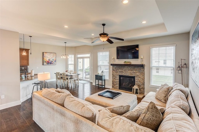 223 Ellington Ct, Glen Carbon, IL 62034 - living room with a tray ceiling, dark wood-style floors, ceiling fan, baseboards, and recessed lighting