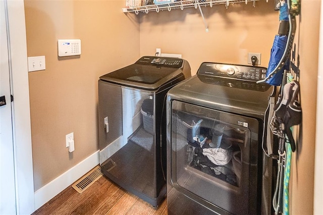 223 Ellington Ct, Glen Carbon, IL 62034 - washroom with independent washer and dryer, wood finished floors, and baseboards
