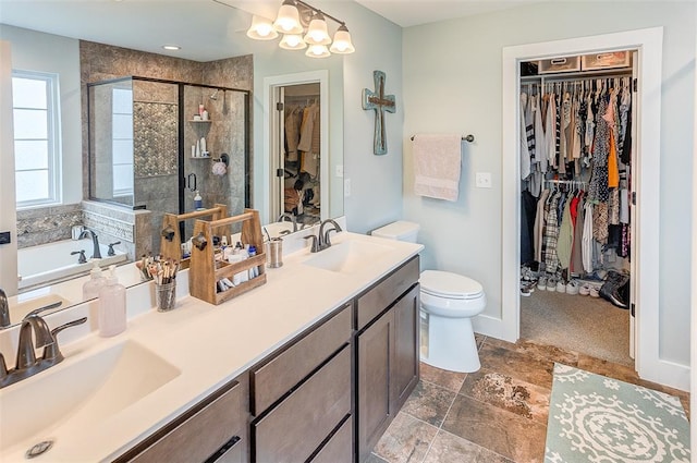 223 Ellington Ct, Glen Carbon, IL 62034 - full bath with a walk in closet, a bath, a stall shower, double vanity, and toilet