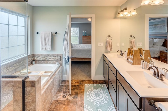 223 Ellington Ct, Glen Carbon, IL 62034 - bathroom with ensuite bathroom, a bath, double vanity, and baseboards
